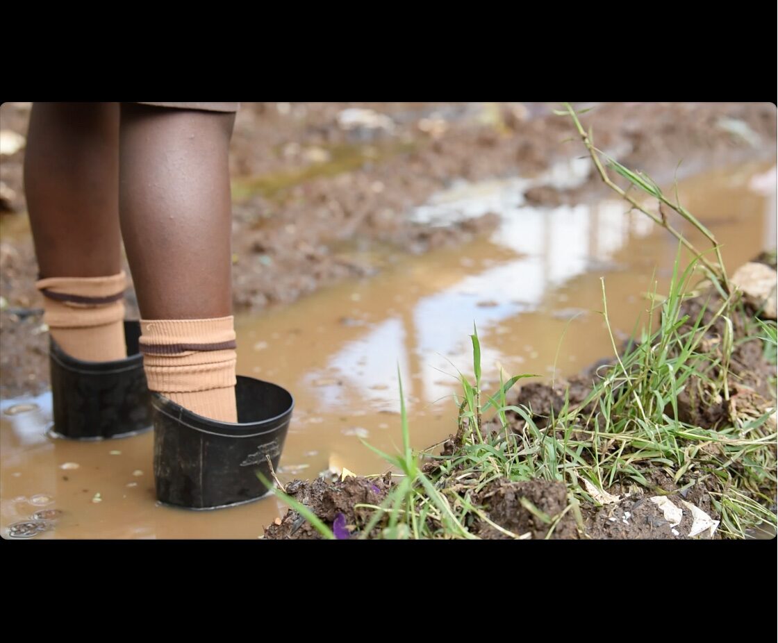 Girl Standing in a Puddle